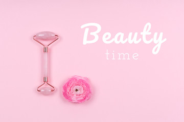 Jade roller with ranunculus flower on pink drop with Beauty time wording. Beauty time, selfcare, beauty log, feminine journal concept