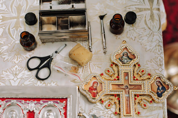 Church items. Items for the rite of christening a child. Cross, holy water, icons, miro, oil...