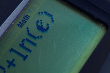 Closeup or macro photo of the scientific calculator buttons. Keys include the mathematical terms. Numerical operation concept.