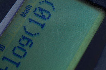 Closeup or macro photo of the scientific calculator buttons. Keys include the mathematical terms. Numerical operation concept.