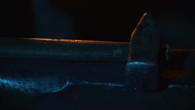 A blacksmith forging horseshoes for horses