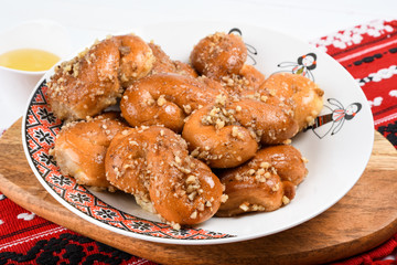 Concept of romanian cuisine. Homemade Mucenici, traditional desserts made in the figure 8