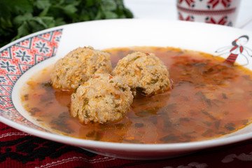 Top view of plate with meatballs soup, traditional plate of the Romanian cuisine,ciorba de perisoare
