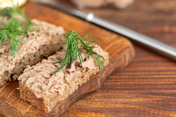 Fresh homemade chicken liver pate with carrots, onions and butter. Garnished with a sprig of dill....