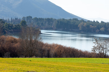 Autumn landscape with lake and mountains