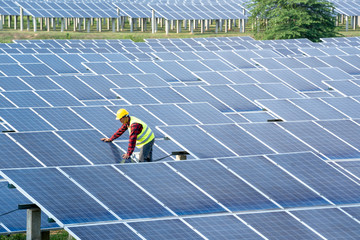 Engineer working on checking and maintenance equipment at industry solar power,Concept of green new energy.
