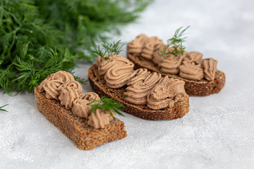Fresh homemade chicken liver pate with carrots, onions and butter. Garnished with a sprig of dill....