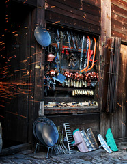 Products made by the iron master in front of the shop