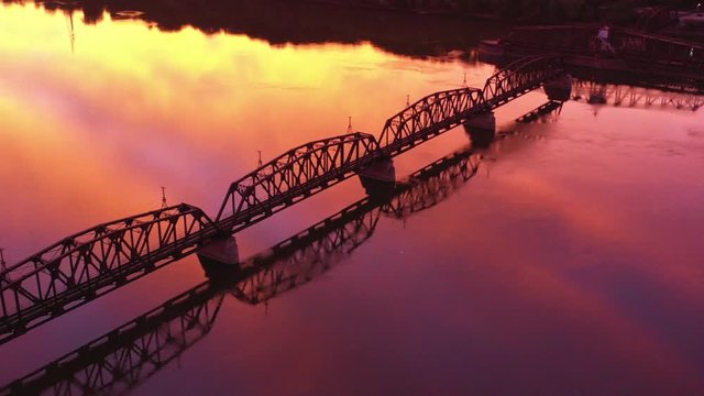 Railroad Bridge and a Towboat with Early Morning Reflections, Dubuque, Iowa, USA