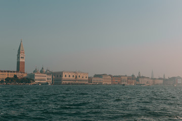 Obraz premium The beautiful, sunny streets of Venice, ancient buildings, canals and roofs