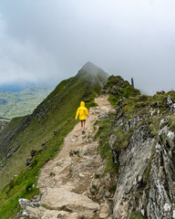 A solo female hiking in Snowdon mount, the highest peak in Wales, UK