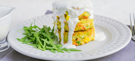 Vegan burgers or cutlets served with sour cream and arugula. Healthy vegan diet food. Banner.