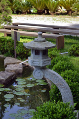 Fototapeta na wymiar japanese sculpture on a zen lake