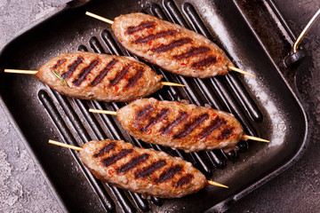 Lula kebab, lyulya-kebab minced meat. grilled with rosemary. Fast food
