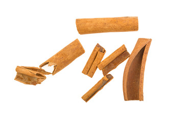 Top view of cinnamon sticks isolated on white