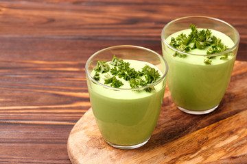 green smoothie with avocado, cucumber, celery and thyme.