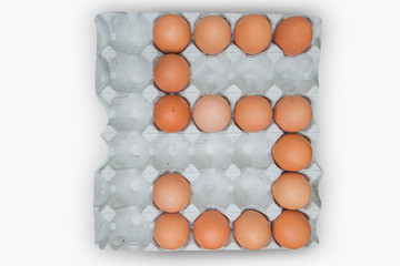 Egg in white corrugated trays.