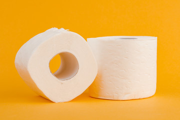 Toilet paper roll on a yellow background.
