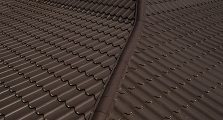 Close up a part of a brown roof of a house.