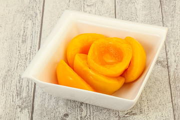 Marinated peaches fruit in the bowl