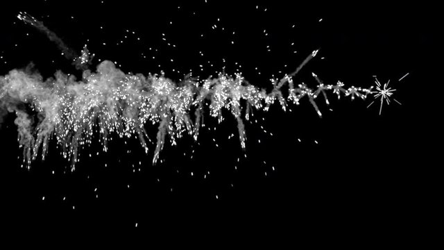 A series of shots striking in a line, and producing sparks and smoky trails. Yellow hues. Separated on pure black background, contains alpha channel.