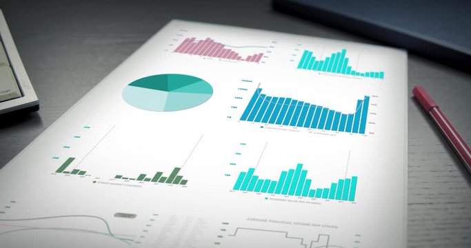 Colorful digital graph, diagram and information on paper at office table