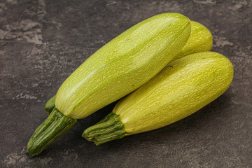 Young tasty zucchini over board