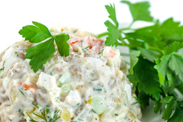 The vinaigrette of various boiled vegetables withe parsley on the plate
