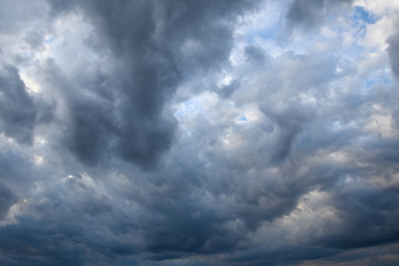 Stormy sky with storm clouns on the sunset with beautiful sun