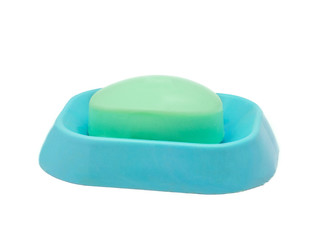 Green soap on a blue soap dish isolated on a white background