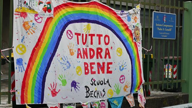 Turin,Piedmont,Italy. May 2020. Coronavirus pandemic. At the entrance of the school a sheet with the rainbow design has been hung and the message Everything will be fine" in Italian "Andr&agrave; tutto bene"