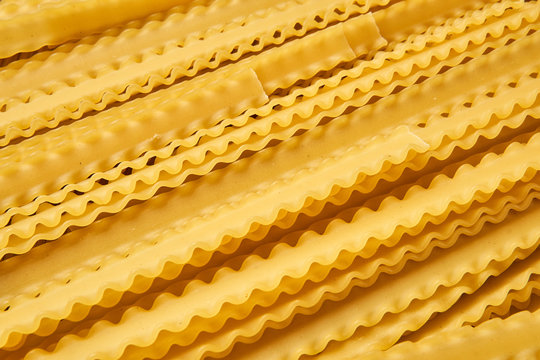 yellow dry mafaldine pasta background