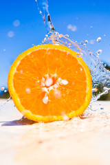 Fototapeta na wymiar Beautiful orange with water under a blue sky