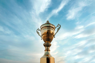 Fototapeta na wymiar winner trophy on sky background