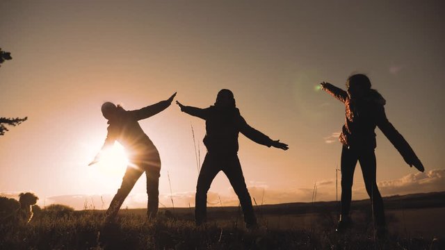 happy family teamwork silhouette hands on hand show flying freedom on airplane childhood dreams. freedom concept happy family joy success. happy lifestyle family mom dad and daughter sunset silhouette