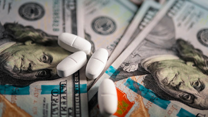 Buying and selling medicines.American hundred dollar bills and Russian currency,1000 rubles.Spending on expensive medicines and treatment in hospitals.The vials with the orange substance on the bills.