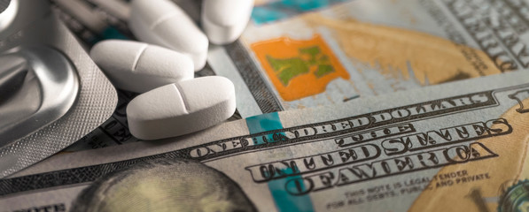 White pills and a hundred dollars. Financing the production of medicines against coronavirus Covid-19 (SARS-CoV-2), viral and bacterial infections in laboratories. Template.