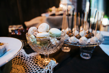 Candy Bar close up. Delicious sweet buffet with cupcakes. Sweet wedding buffet with cupcakes and other desserts.