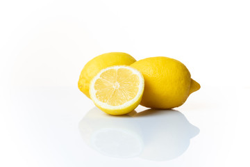 Two and a half lemons isolated on a white background