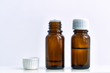 Natural aroma oil for aromatherapy and alternative medicine. Herbal essential oil bottles for homeopathy on a white background