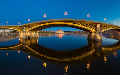 Fototapeta na wymiar Amazing panoramic phot about the Margaret bridge in Budapest Hungary. Evening mood, popular touris attraction a river cruise in this time. panoramic view