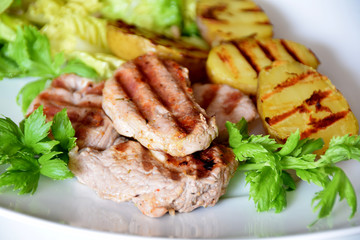 grilled sirloin and grilled potatoes with green salad