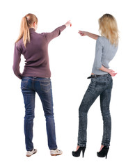 Back view of two pointing girl in sweater.