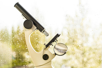 Сoncept of careful observation of the weather. Prediction of rain, thunderstorms. Microscope on...