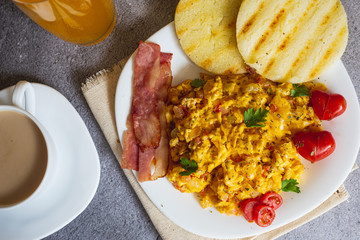 eggs with cheese arepa and tocienta. Typical Colombian breakfast