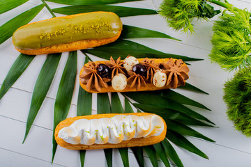 Eclairs pastry made with choux dough filled with cream and topping.Fresh Food Buffet Brunch Catering