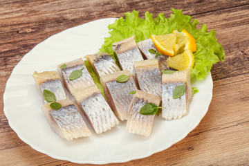 Herring fillet with sliced lemon