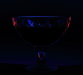 close up of crystal bowl on black background