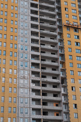 Cluster of high rise apartment buildings windows.