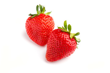 A pair of strawberries on white isolated background